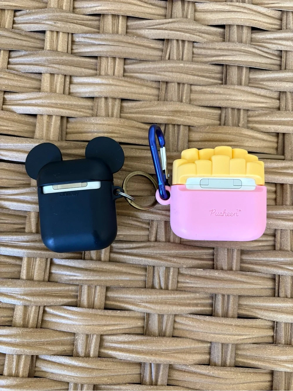 2 Apple AirPods with cases